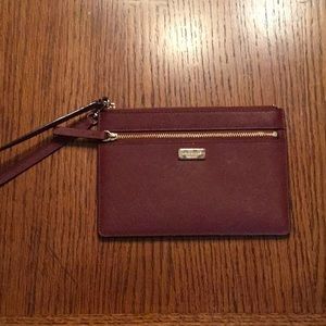 Kate Spade wristlet in burgundy